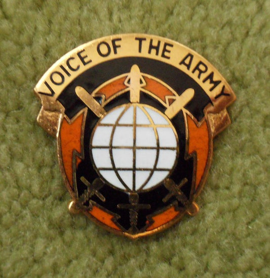 metal emblem with inscription, voice of the army